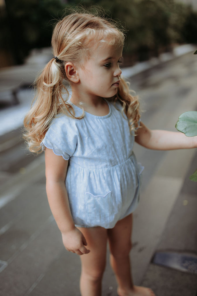 Light Blue Romper with Scalloped Pocket and Sleeves